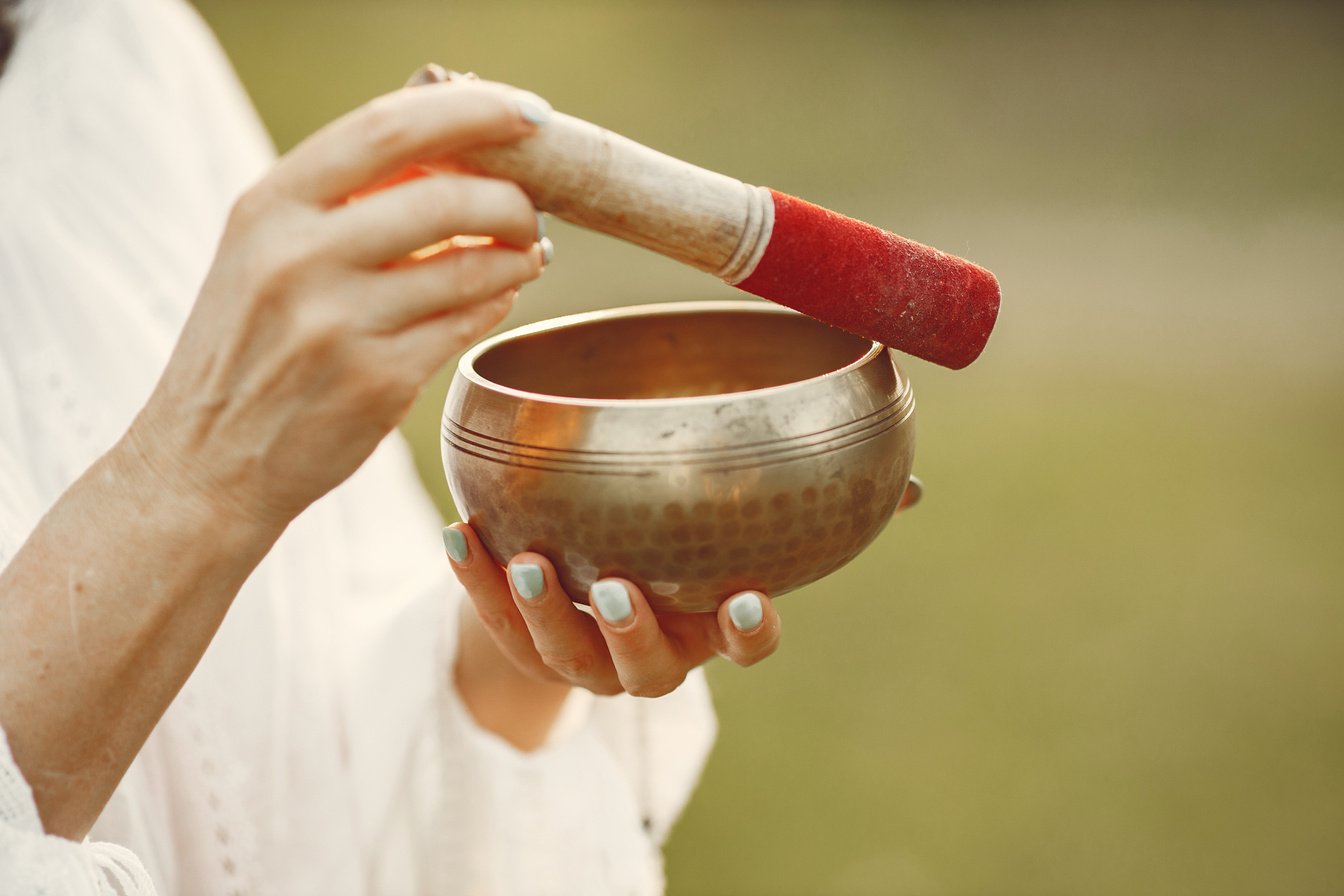 Woman Holding Chanting Bowl